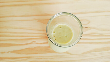 Brazilian avocado smoothie on a wooden background
