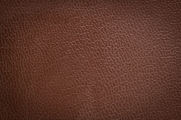Closeup detail of brown leather texture background.