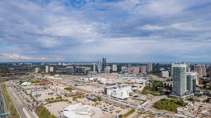 Drone shot of a cityscape view under cloudy blue sky
