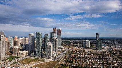 Fototapeta na wymiar Drone shot of a cityscape view under blue cloudy sky