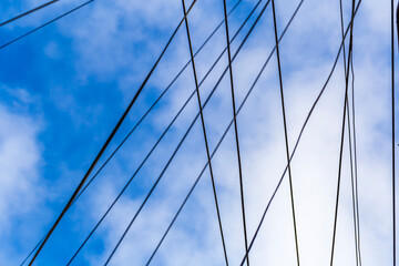 Fototapeta na wymiar Low angle view of cables against blue sky