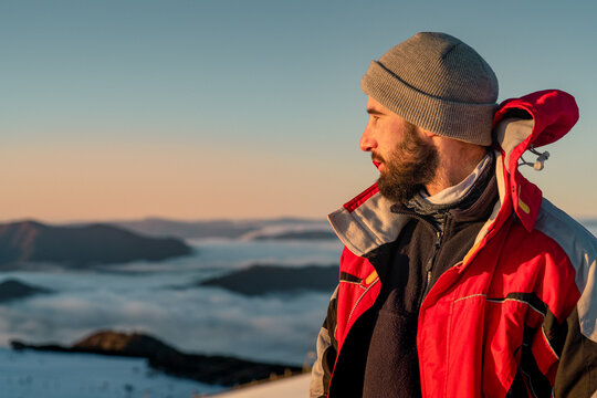 person in the snowy mountains - Powered by Adobe