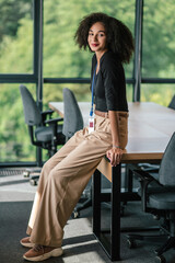 Pretty elegant curly-haired businesswoman in the office