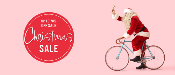 Santa Claus with bell riding bicycle and text CHRISTMAS SALE on pink background