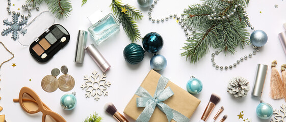 New Year composition with makeup cosmetics, gift and female accessories on white background