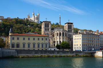 Fototapeta na wymiar View of Cathedral of Saint-Jean and Notre Dame de Fourviere Basilica on hill on bank of river Saone in Lyon, France ..