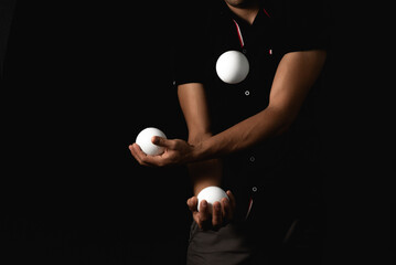 close up portrait of juggling balls, on black background