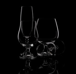 glasses glasses for cognac wine on a black background