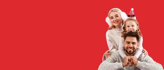 Happy family on red background with space for text. Christmas celebration