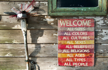 Welcome sign outside a New Orleans bar. All sizes, colors, cultures, sexes, beliefs, religions, ages types, people.