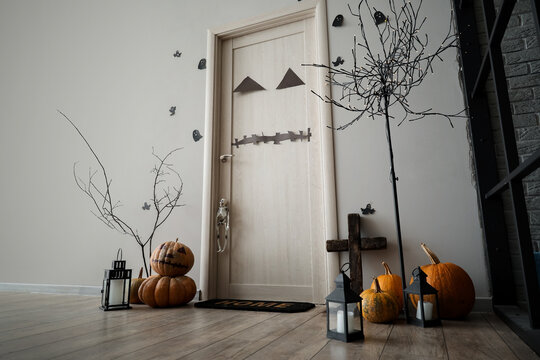 Interior Of Light Hall Decorated For Halloween With Door And Tree Floor Lamp