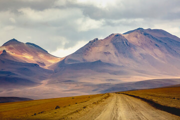 Dirt road in Atacama desert, volcanic arid landscape in Chile, South America