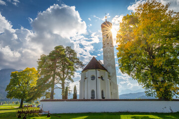 Idyllic St Coloman Church in Allgau, Bavarian Alps at sunny springtime, Germany