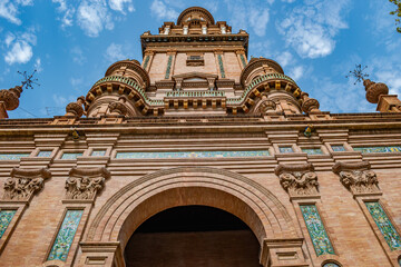 Fototapeta premium Perspective and detail of Plaza de España tower in brick and colorful ceramic tiles, Seville SPAIN
