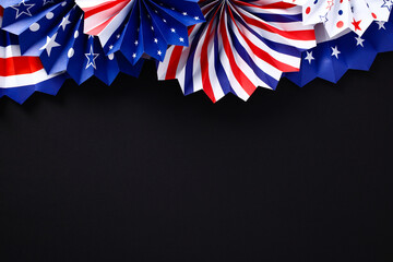 Paper fans in USA flag colors on black background. Banner mockup for Veterans Day, Memorial Day, 4th of July.