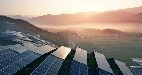 aerial view of solar power station on hill