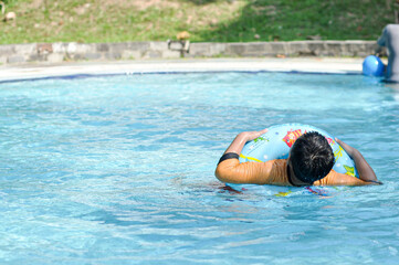 Photo of a boy having fun playing waterball during the school holiday season