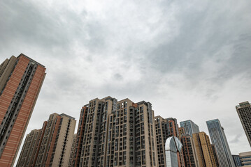 Residential buildings against overcast sky low angle view in Chengdu, Sichuan province, China