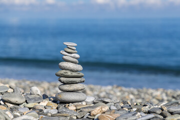 Fototapeta na wymiar Pebble stone over the blue sea