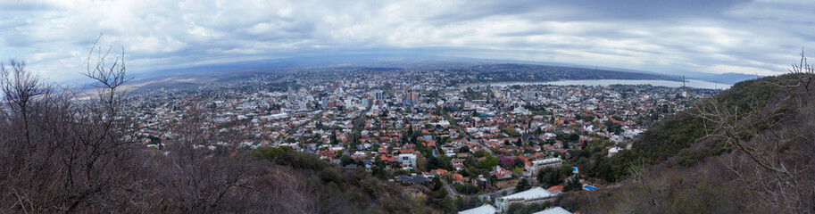 Cityscape of Villa Carlos Paz, Cordoba. Taken from the top of a hill on a clouded sky morning      