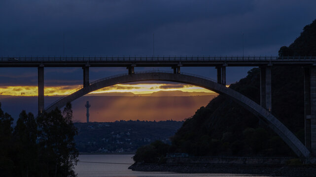 Sunset landscape from the San Roque dam, looking to a large bridge and the last minutes of  sunlight in Villa Carlos Paz , Cordoba 