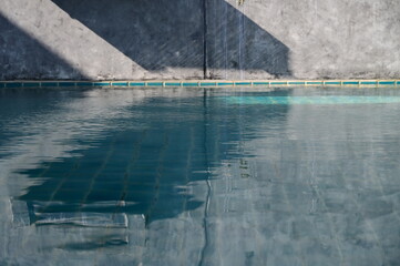 blue swimming pool and cement wall, construction industry