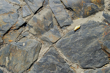 Background of stone wall texture. Stone wall texture background. Part of a stone wall, for...