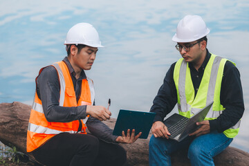 Environmental engineers work at wastewater treatment plants,Water supply engineering working at Water recycling plant for reuse,Technicians and engineers discuss work together.