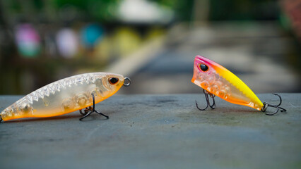 Artificial lure made from plastic for fishing by casting. Selected focus of casting lure with hook - Artificial lure with the shape of minnow