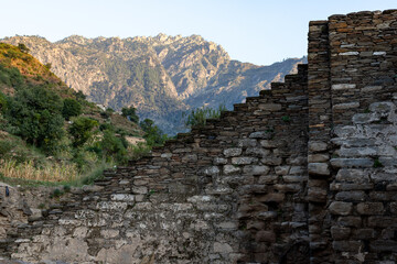 Fototapeta na wymiar The main stairs of Amluk dara stupa. It is situated about 2km on the north of Nawagai village in the beautiful small valley of Amluk Dara, on the main road to Buner