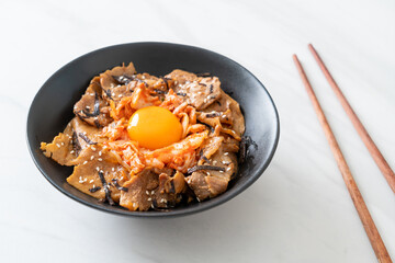 pork bulgogi rice bowl with kimchi and Korean pickled egg