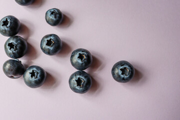 Obraz na płótnie Canvas blueberries on purple background