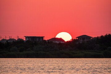The sun goes down over a lake