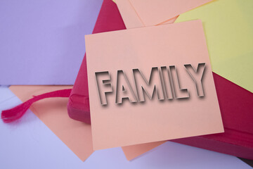 Family. Text on adhesive note paper. Event, celebration reminder message.