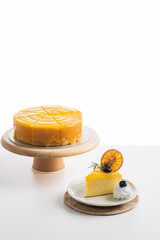 Traditional french lemon cake..a piece of lemon cake on a white plate decorated with lemons, food concept