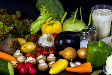 vegetables and diet food on a black background, top view, flatley