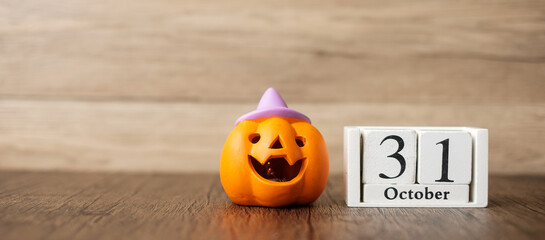 Happy Halloween day with Jack O lantern pumpkin and 31 October calendar. Trick or Threat, Hello...