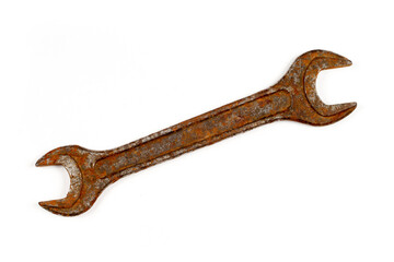An old rusty wrench on a white background.