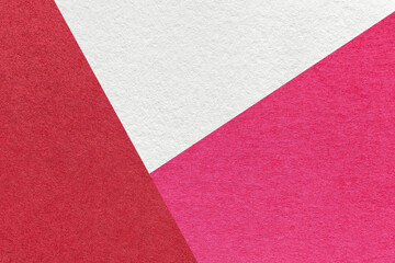Fototapeta premium Texture of craft white, red and magenta color paper background, macro. Vintage wine abstract cardboard with gradient.