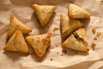 Vegetable samosas on parchment paper macro
