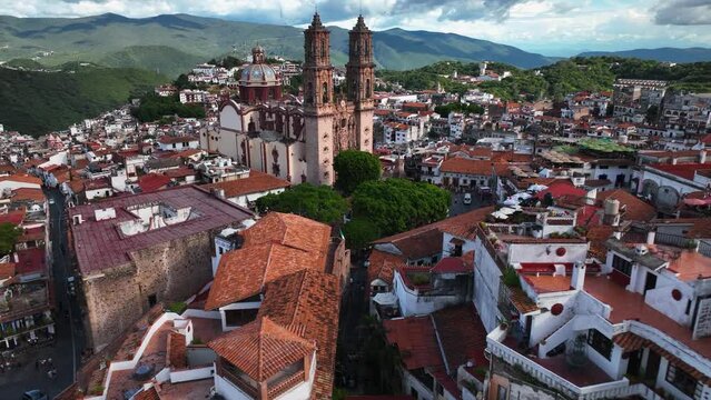 Aerial view towards the Church of Santa Prisca, in Taxco Guerrero, Mexico - approaching, drone shot