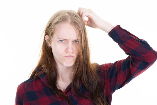 young puzzled woman scratching head thinking about wrong bad problem on white background girl facial expression emotion