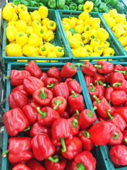 Colorful bell peppers in a basket with a super sale
