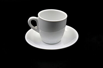 Cup of white coffee on a dark background