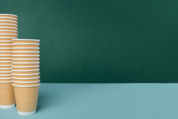 Eco friendly,take away disposable cup kraft paper and tray on green background.food packaging