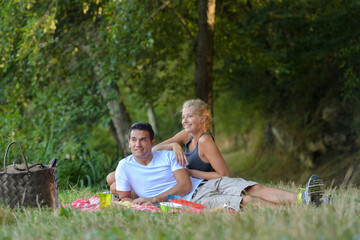 happy couple relaxing on a picnic