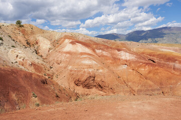 Fototapeta premium Altai Mountains, Mars 1 - red mountains against a background of blue sky with clouds.