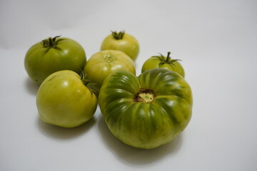 Autumnal fruits for sale at a farmers market in Wakefield, green tomatoes, Healthy red and green tomatoes at spanish market, fresh red tomatoes ready to be sold at the korean market