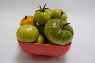 Autumnal fruits for sale at a farmers market in Wakefield, green tomatoes, Healthy red and green tomatoes at spanish market, fresh red tomatoes ready to be sold at the korean market