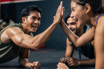 Group of multiethnic athlete fitness trainer friends workout in gym